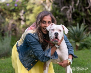 portrait-woman-and-white-pitbull-in-garden