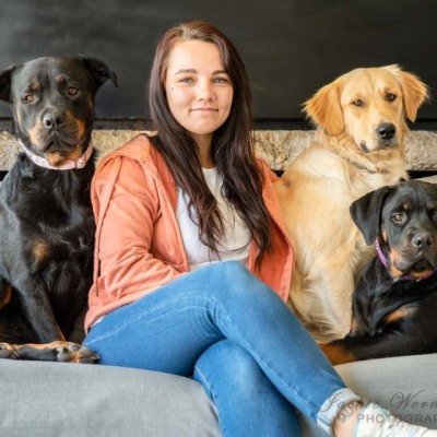 woman-on-sofa-with-three-big-dogs