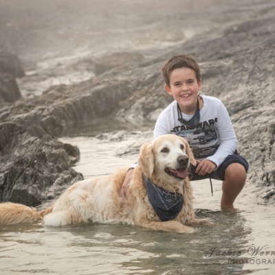 boy-and-dog-playing-in-the-rock-pools