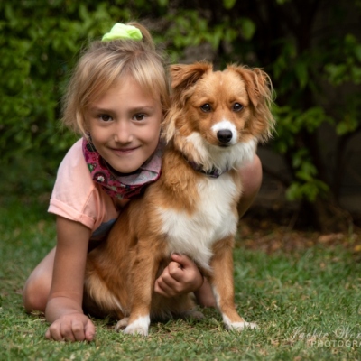 little-girl-posing-with-cute-puppy