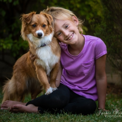 little-girl-posing-with-fluffy-dog