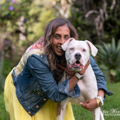 portrait-woman-and-white-pitbull-in-garden
