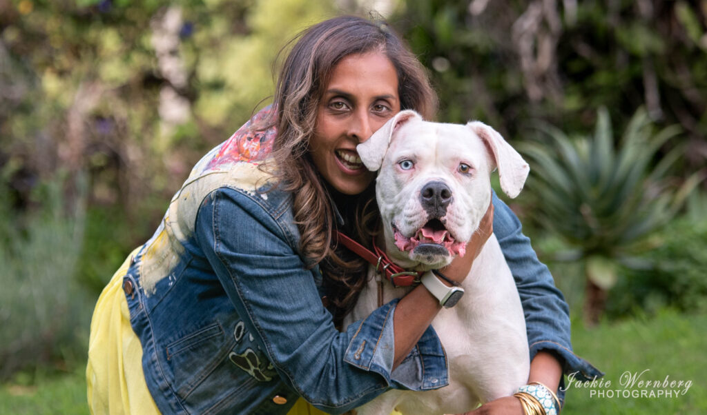 pitbull in country garden with owner